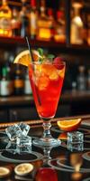 Refreshing cocktail served with fresh fruit at a lively bar in the evening photo
