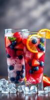 Refreshing summer berry drinks served in tall glasses with ice and fruit garnishes photo