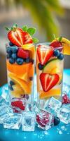 Refreshing fruit-infused drinks served in tall glasses with vibrant berries and ice on a sunny day photo