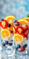Refreshing fruit cocktails with ice cubes in glasses on a bright background photo