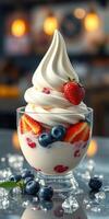 Delicious dessert featuring whipped cream, strawberries, and blueberries in a glass bowl photo