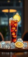 Refreshing iced beverage served with lemon slices and ice cubes on wooden table in a cozy setting photo
