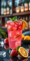 Refreshing summer cocktail with strawberries and citrus garnishes served at a vibrant bar setting photo