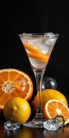 Refreshing citrus cocktail in a stylish glass with ice and fresh fruit on a dark background photo