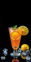 Refreshing citrus beverage served in a decorative glass with ice and lemon slice against a dark backdrop photo