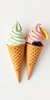 Colorful soft serve ice cream cones with mint and strawberry flavors topped with fruits photo