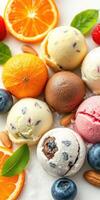Variety of colorful ice cream scoops with fresh fruits and nuts arranged on a platter photo