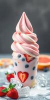 Colorful swirl ice cream topped with fresh strawberries and blueberries served on a table photo