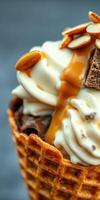 Delicious ice cream cone topped with caramel sauce and almonds in a cozy dessert setting photo