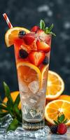 Refreshing fruit cocktail garnished with berries and citrus slices served in a tall glass photo