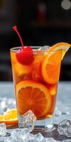Refreshing citrus cocktail with bright colors and ice served in a clear glass photo