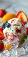 Creamy strawberry and blueberry ice cream topped with fresh fruit and mint garnished with ice cubes on a marble surface photo