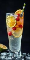 Refreshing fruit soda with ice and vibrant garnishes served in a tall glass photo