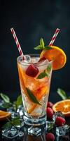 Refreshing fruit cocktail with mint and ice in a glass on a dark background photo