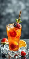 Refreshing summer cocktail with berries and citrus garnishes served on ice photo