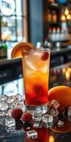 Refreshing cocktail served with garnishes and ice on a bar countertop during late evening hours photo