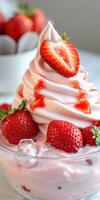 Delicious soft-serve ice cream topped with fresh strawberries and strawberry syrup in a dessert bowl photo