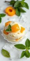 Delightful summer dessert featuring creamy ice cream topped with fresh apricot and mint leaves photo