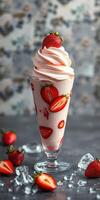 Delicious strawberry milkshake topped with whipped cream and fresh strawberries in a glass photo