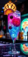 Colorful cocktail served in a tall glass with ice and fruit garnishes at a trendy bar during nighttime photo