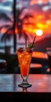 Stunning sunset with refreshing cocktail at a beachside bar photo