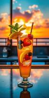 Colorful cocktail garnished with fresh fruit against a vibrant sunset backdrop in a rooftop bar photo