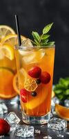 Refreshing summer beverage with citrus, berries, and ice in a glass on a dark background photo