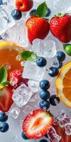 Fresh fruit and ice cubes create a vibrant composition for summer refreshments photo
