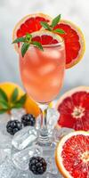 Refreshing citrus beverage garnished with fresh mint and vibrant fruit slices photo