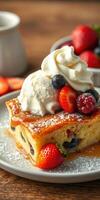 Delicious dessert featuring fluffy pancake with berries and ice cream served on a wooden table photo