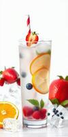 Refreshing summer beverage with fresh fruits and ice in a tall glass on a white background photo