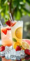 Refreshing summer cocktails with fresh strawberries and citrus fruits served over ice photo