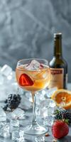 Refreshing summer cocktail served in an elegant glass with strawberries and blackberries on ice photo