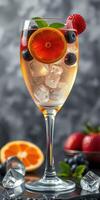 Refreshing fruit cocktail served in a tall glass with ice at a summer gathering photo