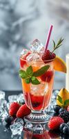 Refreshing mixed berry cocktail served with mint and citrus on a summer afternoon photo