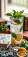 Refreshing mint lemonade drink garnished with mint and lemon slices on a sunny day photo