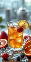 Refreshing iced tea with fresh fruits served in a clear glass on a wooden table photo