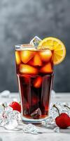 Refreshing iced beverage adorned with lemon and strawberries served in a tall glass with ice cubes photo