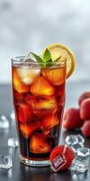 Refreshing iced beverage with mint and lemon slices served in a tall glass on a dark table photo