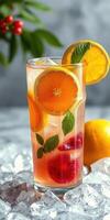 Refreshing fruit-infused drink on ice featuring citrus and mint garnishes during a summer afternoon photo