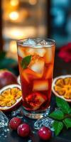 Refreshing iced beverage featuring vibrant fruits and mint garnishes in a cozy indoor setting during summer photo