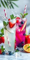 Refreshing summer cocktails with berries and mint garnished on a marble surface photo