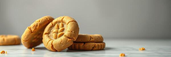 Delicious homemade peanut butter cookies stacked on a marble countertop in a cozy kitchen setting photo