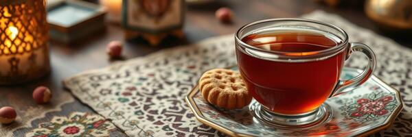 Warm cup of tea with cookie on decorative table in cozy setting with ambient lighting and intricate patterns photo