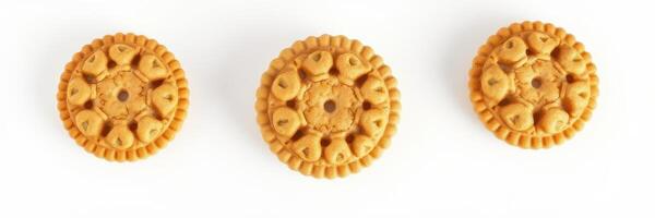 Decorative cookies arranged in a row on a white background showcasing intricate designs and patterns photo