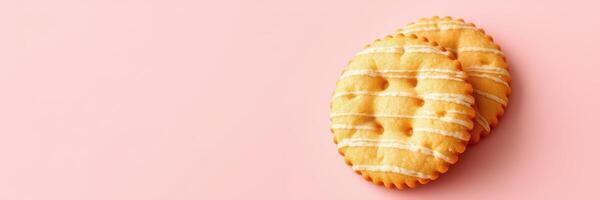 Deliciously baked cookies with a sweet icing drizzle on a soft pink background perfect for dessert lovers photo
