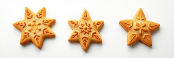 Delicate star-shaped cookies decorated with intricate patterns on a white background photo