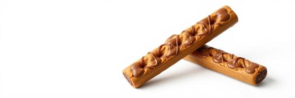 Delicious chocolate-covered wafer rolls placed on a clean white surface for an appealing snack presentation photo