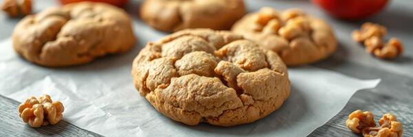 Freshly baked cookies with nuts arranged beautifully on a parchment paper background photo