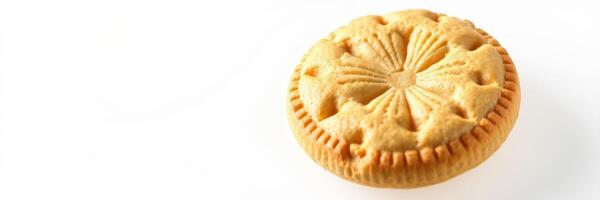 Unique round baked cookie with decorative pattern displayed on a simple white background photo